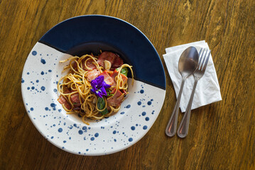 A Freshly Cooked and Delicious Spicy Ham Spaghetti Served on the Dining Table.