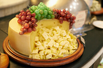 Food, grapes and cheese in restaurant buffet for catering service, snack selection and banquet for...