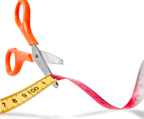 Scissors Cutting a Tape Measure. Copy space