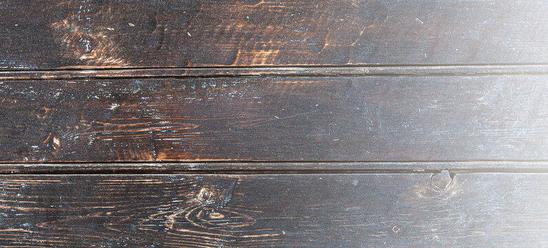 Old texture painted wooden boards on sunlight