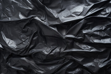Processed collage of black cellophane garbage bag texture. Background for banner, backdrop