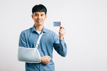 A man with a damaged arm displays confidence, wearing a support splint and settling medical...