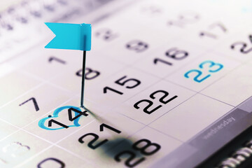 Calendar with circled date february 14. Blue heart shape. Blue flag. Valentines day.