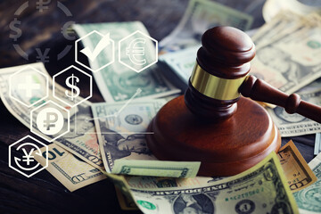 Judge gavel On Dollar Cash. Corruption, Bankruptcy Court, Crime, Bribing, Fraud, Auction Bidding concept.