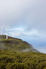 Wind turbines on a cliff.