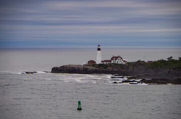 New England lighthouse and seascape ocean landscape nature view in Portland, Maine bay with horizon...