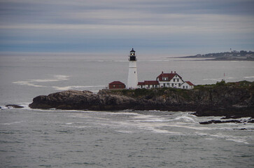 New England lighthouse and seascape ocean landscape nature view in Portland, Maine bay with horizon...