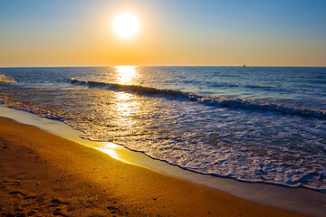 sandy sea beach at the sunset, summer sea vacation scene