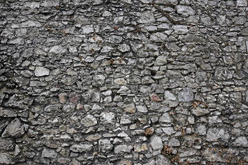 Rough stone grey wall.