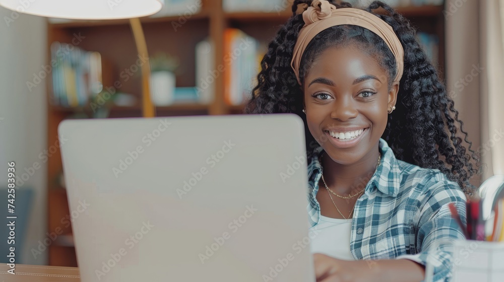 Aufkleber millennial female studying with computer and laptop sitting at desk working on laptop, writing lette