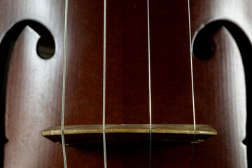 Vintage Concert Violin Bridge and Strings Closeup View - 742588751