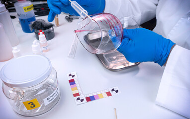 Police expert gets blood sample from a broken glass cup in Criminalistic Lab, conceptual image