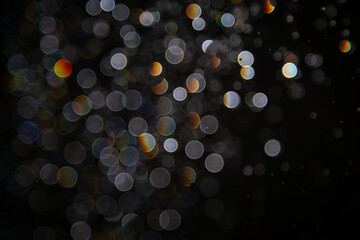 Luxury Bokeh with gold light and colurful rainbow curcle on black