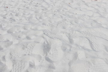 Fine white sand that glistens and reflects the sunlight.