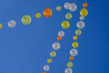 Colourful lampions in the blue sky