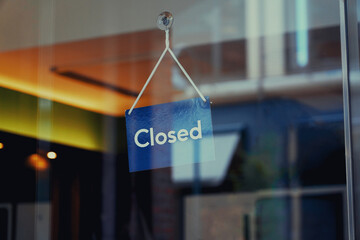 "Closed" sign in the shop window 