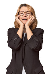 Caucasian woman in black business suit whining and crying disconsolately.