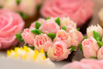 Delicious Gourmet Cupcakes Topped with Buttercream Frosting Flowers