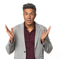 Middle-aged Latino man surprised and shocked.