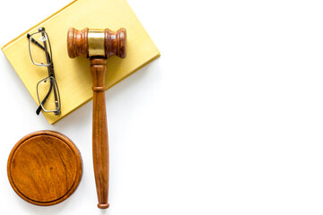 Wooden judge gavel with law book, top view. Law education concept