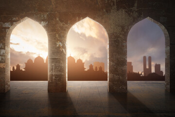 Arched mosque window with a view of a silhouette of the mosque with a dramatic sky view
