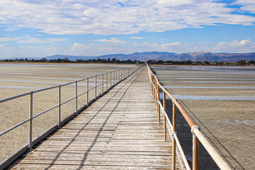 Fototapeta na wymiar Port Germein jetty in South Australia, opened in 1881 and is 1532 metres long. Due to the very shallow waters of the township, it used to be the longest wooden jetty in the southern hemisphere