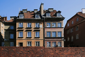 The medieval city wall and amazing old facade buildings in the Old Town of Warsaw, capital of Poland