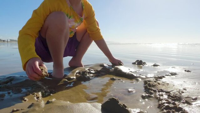 Little girl winter clamming at Pismo Beach