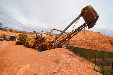 Rusty old blower truck in the rugged desert outside the Old Timers Mine in Coober Pedy, South Australia