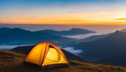 camping tent on mountain peak at sunrise travel and vacation concept