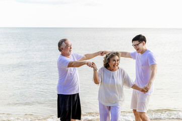 Happy asian family, senior retired couple and young man smiling and  enjoying at sea beach in retired vacation. Health care, Family outdoor lifestyle - 742667301