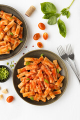 Rigatoni, with tomato and basil sauce. Typical dish of Italian cuisine.