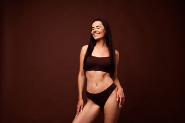 Fototapeta premium No filter photo of stunning dreamy girl sportive shape thin waist belly hips wear stylish lingerie isolated on brown color background