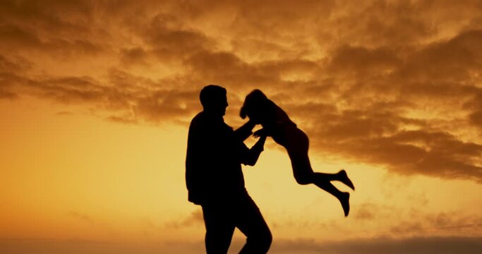 Father, kid and lift in sunset with silhouette, spin and airplane games with clouds in nature on holiday. Person, child and bonding with love, care and family at dusk for outdoor vacation with sky