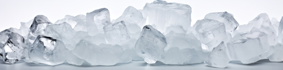Wide view of a row of ice cubes on a white background.