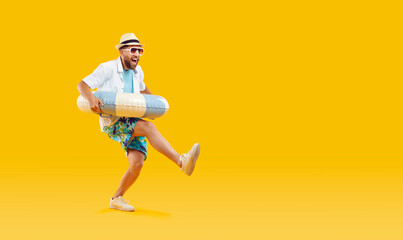 Full body photo of a happy funny man in sunglasses holding rubber ring and having fun isolated on...