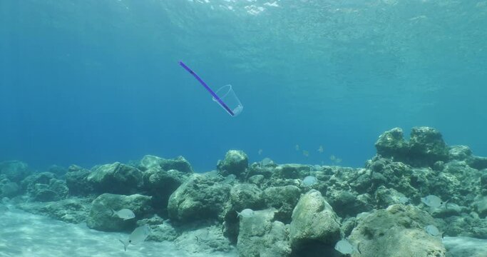 plastic waste underwater bad for fish with sun rays  background ocean pollution