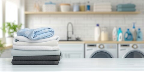 stack of fold clothes on white table with blur laundry room background copy space