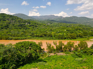 Fototapeta na wymiar Drone View: Side Perspective of Rio Omitlan Meandering Through Verdant Landscape