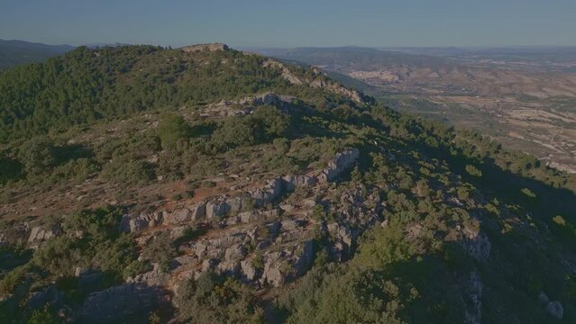 Aerial view looking at a nevera (snow pit) these snow pits were used in antiquity to preserve the fallen snow, Cava Don Miguel, Mariola mountain, Alicante, Spain - stock video
