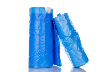 Two packs of plastic garbage bags, macro, isolated on white background.