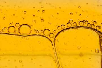 golden drops of oil or serum surface background