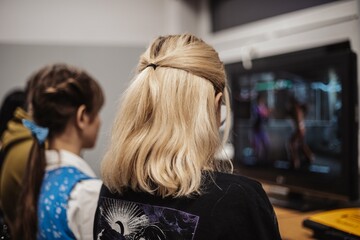 Girl playing a video game computer having fun
