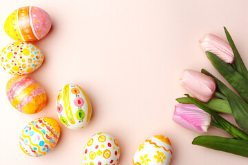 Easter background. Handmade painted eggs lie on a pink background. - 742750337