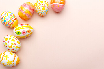 Easter background. Handmade painted eggs lie on a pink background. - 742750354