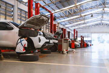 car repair in garage service station with soft-focus and over light in the background