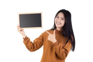 Woman holding a chalkboard and pointing to it isolated on white background with clipping path.