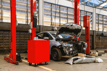 car repair in garage service station with soft-focus and over light in the background