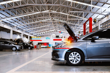 car repair in garage service station with soft-focus and over light in the background