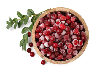 Frozen red cranberries in bowl and green leaves isolated on white, top view